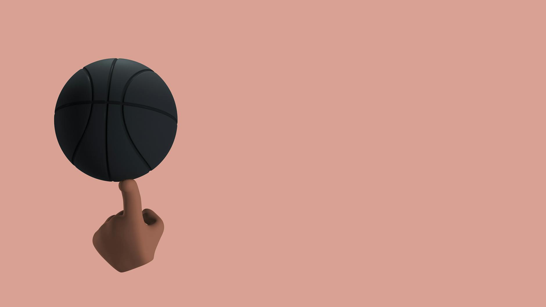 a black ball balancing on a finger